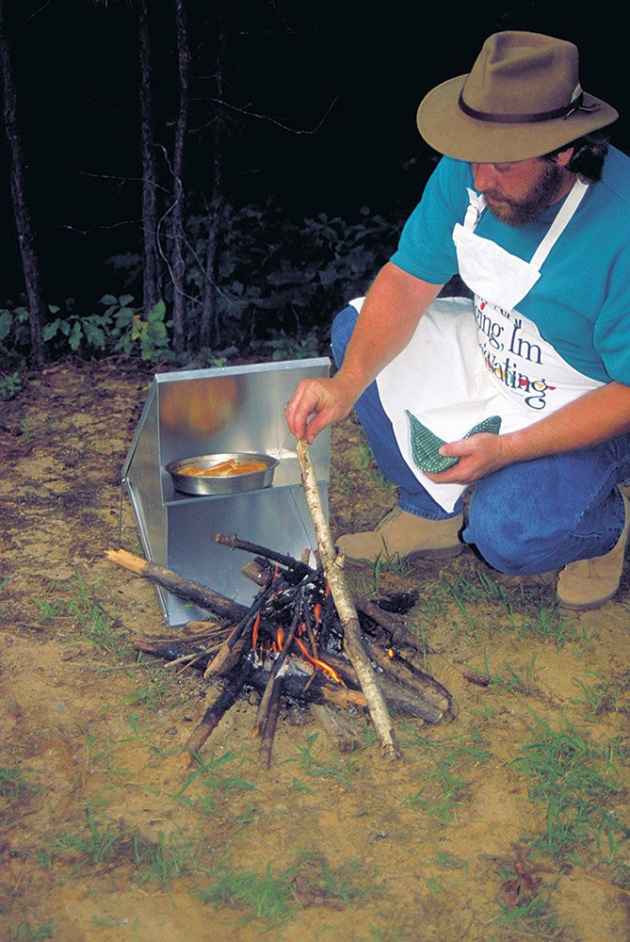 horno_cocina Un horno reflector le permite cocinar uniformemente al aire libre